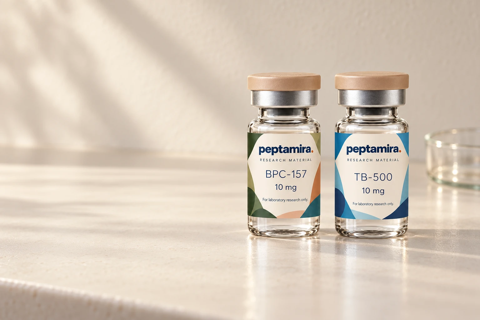Peptamira BPC-157 and TB-500 research materials on a naturally lit workbench